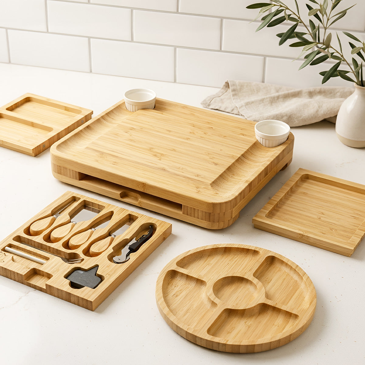 Set of Zulay Kitchen Bamboo Cheese Board Set on a light surface with a white tiled wall background.