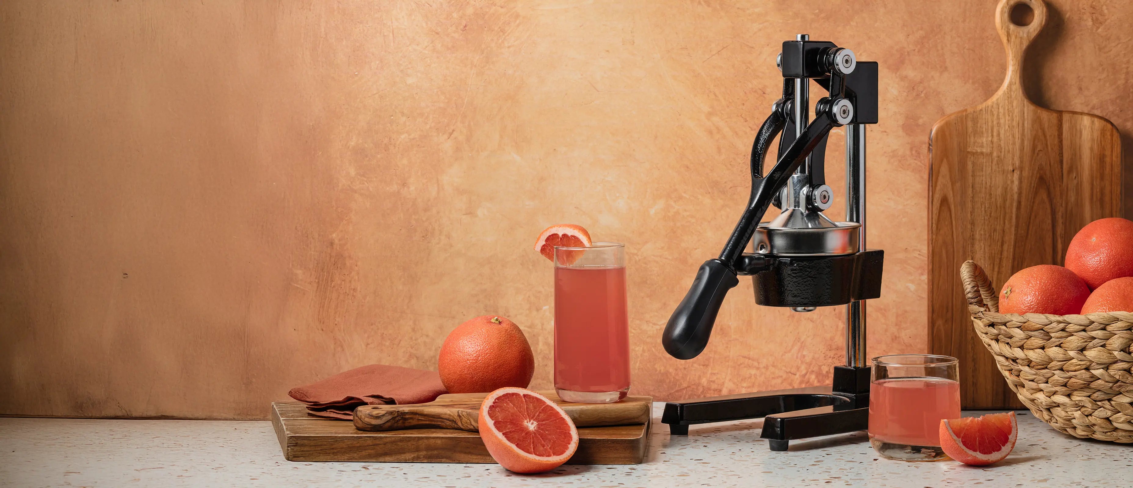 Juicing oranges using the Zulay Kitchen manual juice press.