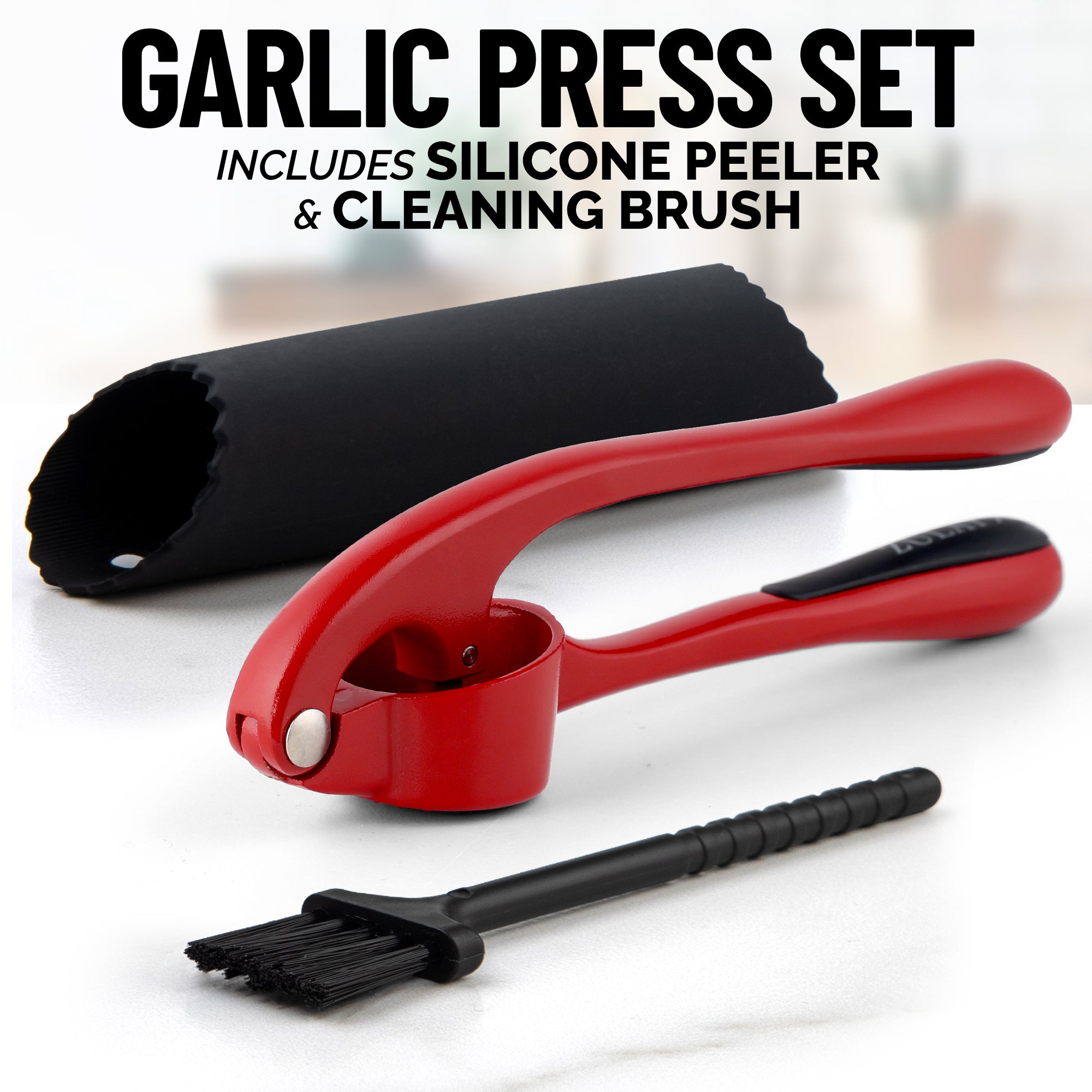 Garlic press set with silicone peeler and cleaning brush on a white background