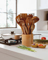 teak wood utensil set on kicthen counter