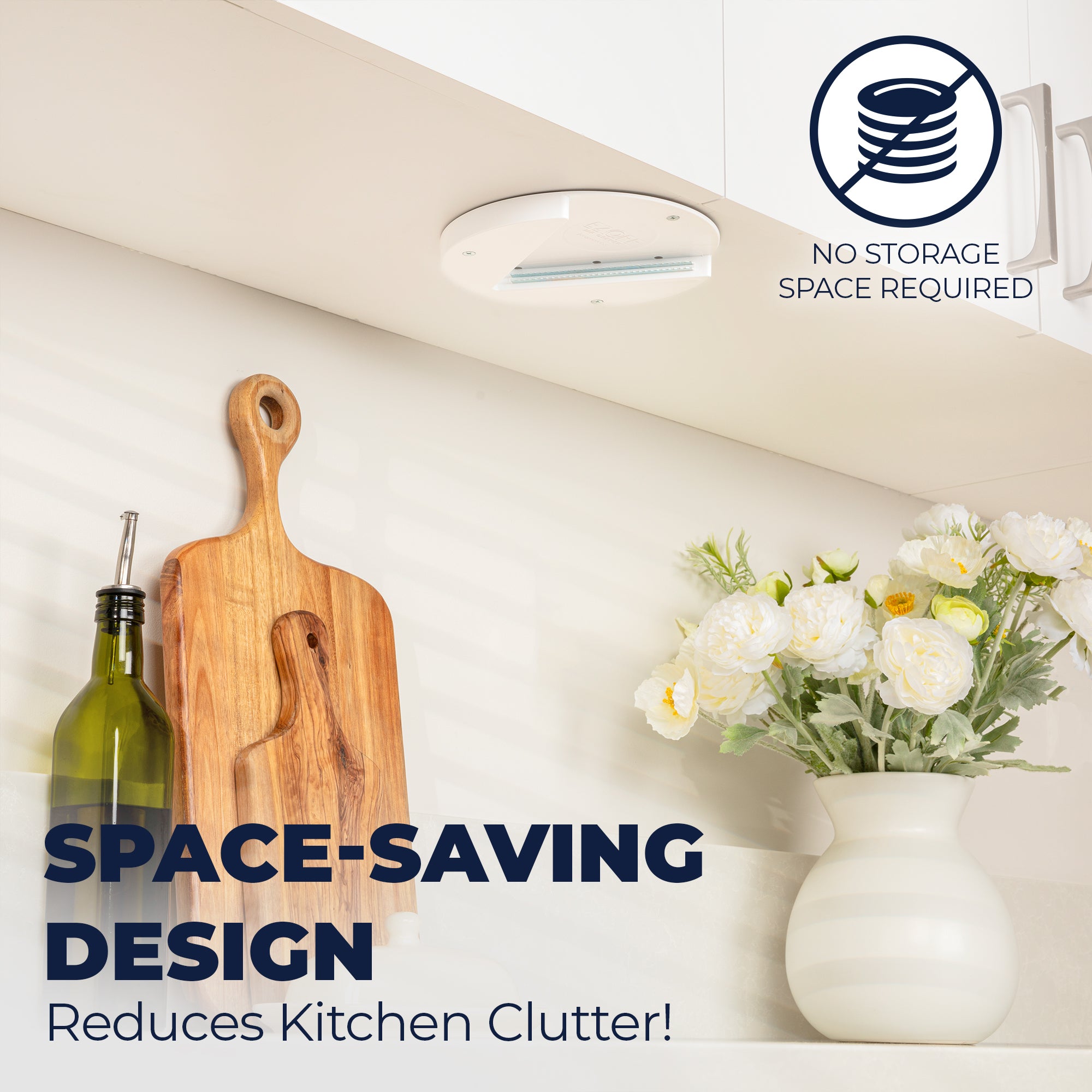 Modern kitchen with a EZ Off Under Cabinet Jar Opener, cutting board, bottle, and flowers on a white countertop with text about space-saving design.