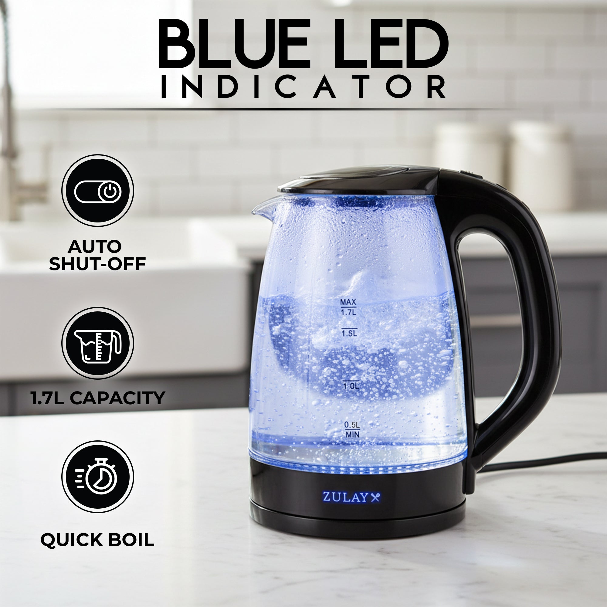Electric kettle with blue LED indicator on a kitchen counter, featuring Zulay branding.