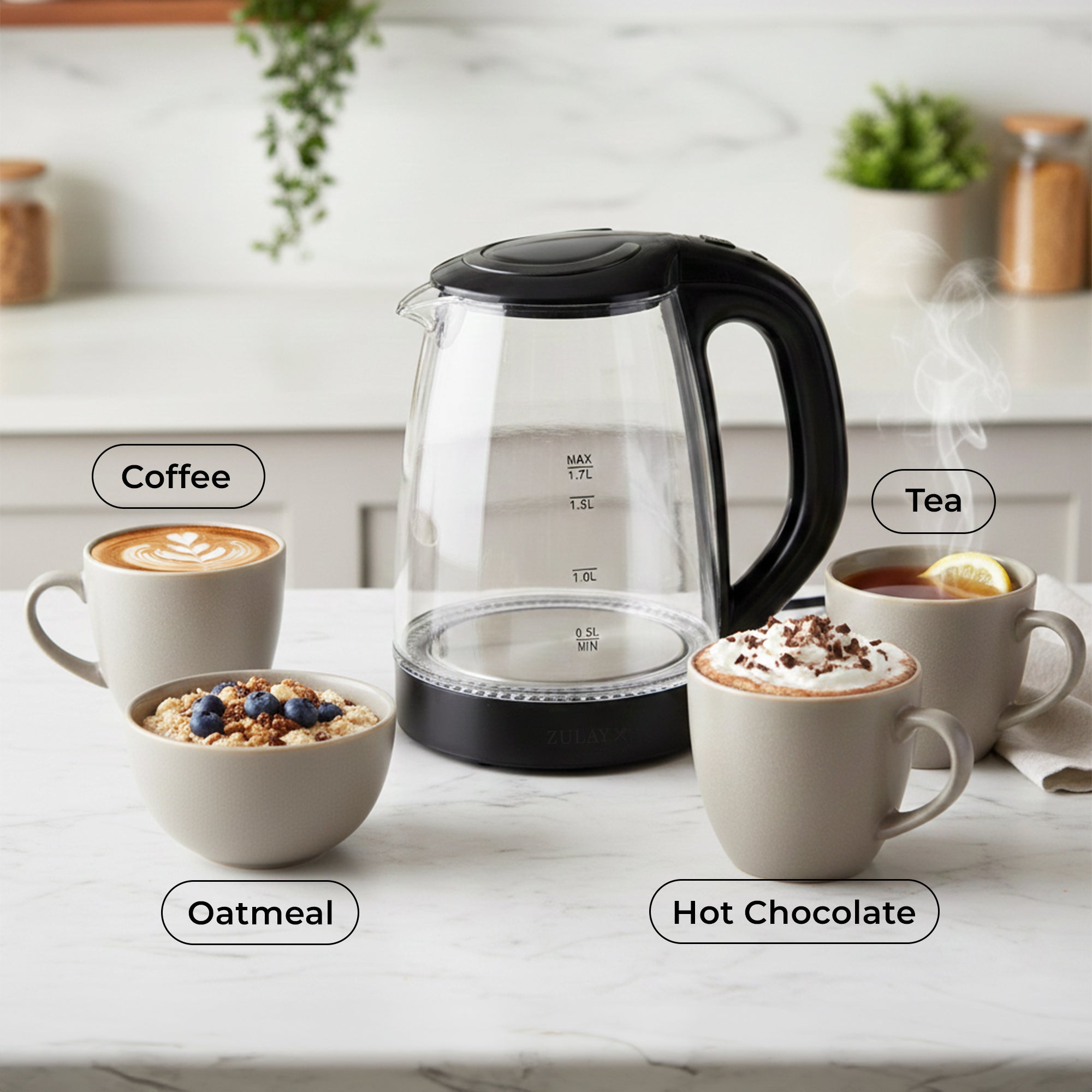 Zulay Kitchen Glass Electric kettle on a kitchen counter with cups of coffee, tea, oatmeal, and hot chocolate.