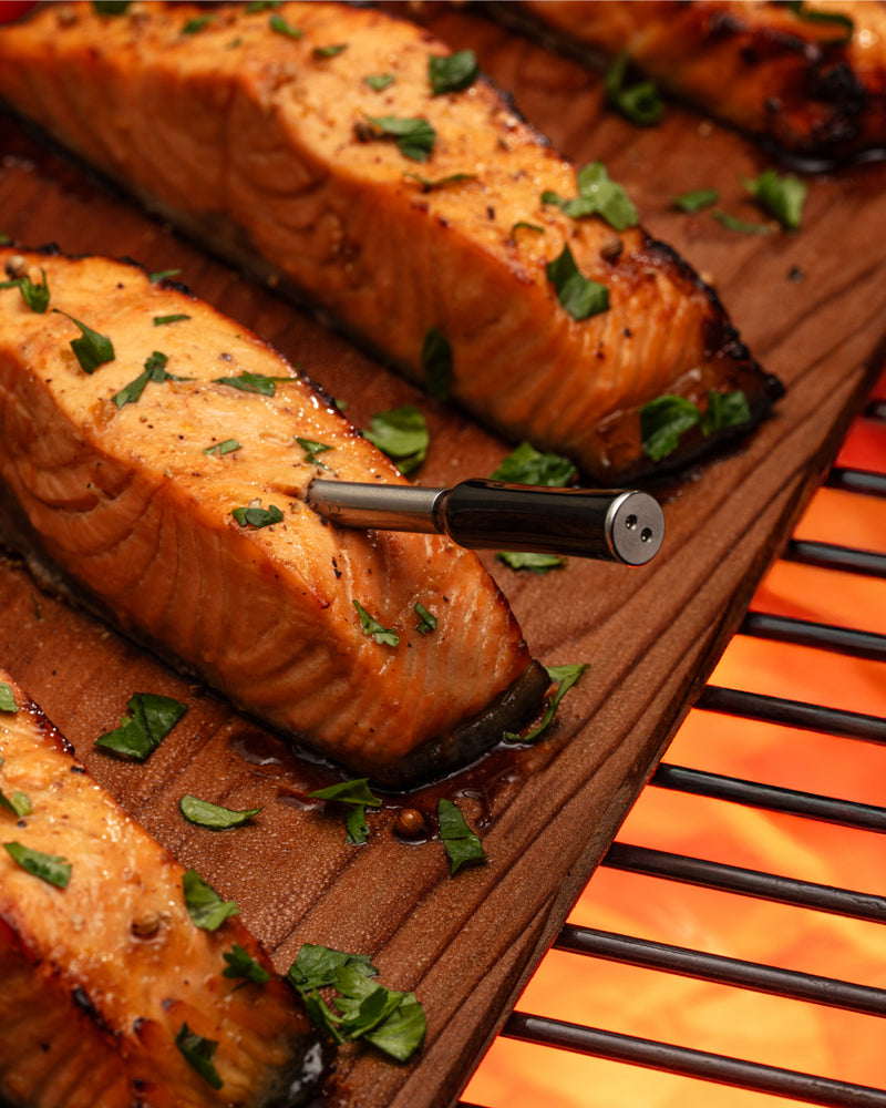 Grill Tech wireless thermometer in a grill 
steak