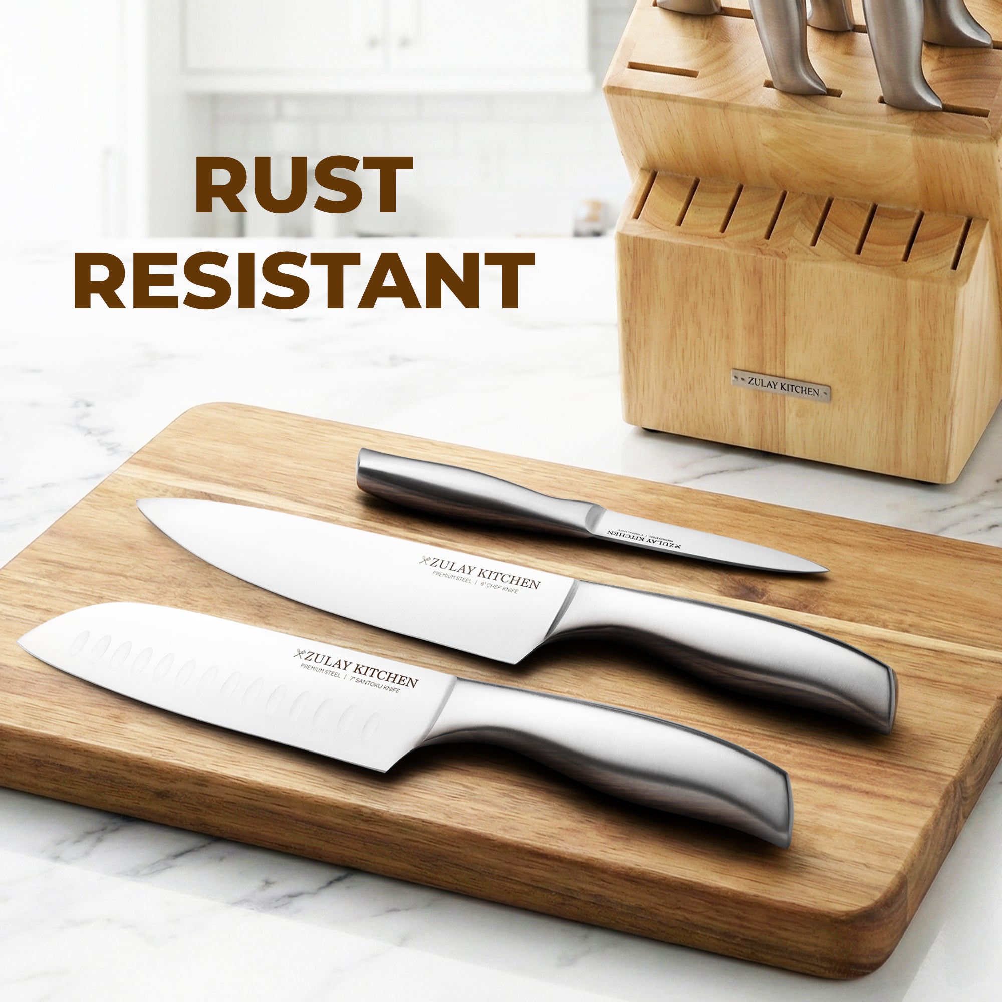 Set of knives on a wooden cutting board with a knife block in the background, featuring the brand 'ZULAY KITCHEN'.