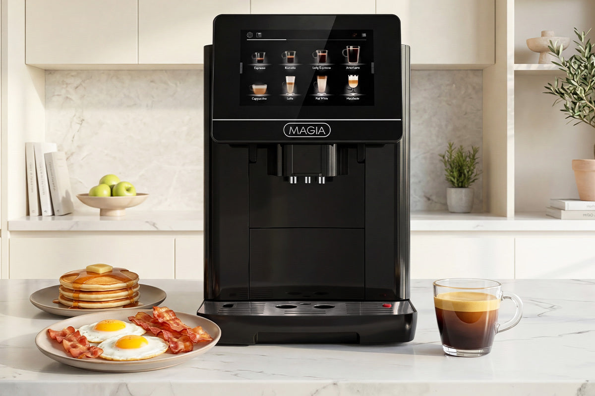 Black Zulay Magia Super Automatic Espresso Machine on a kitchen counter with a plate of breakfast items and a cup of coffee.