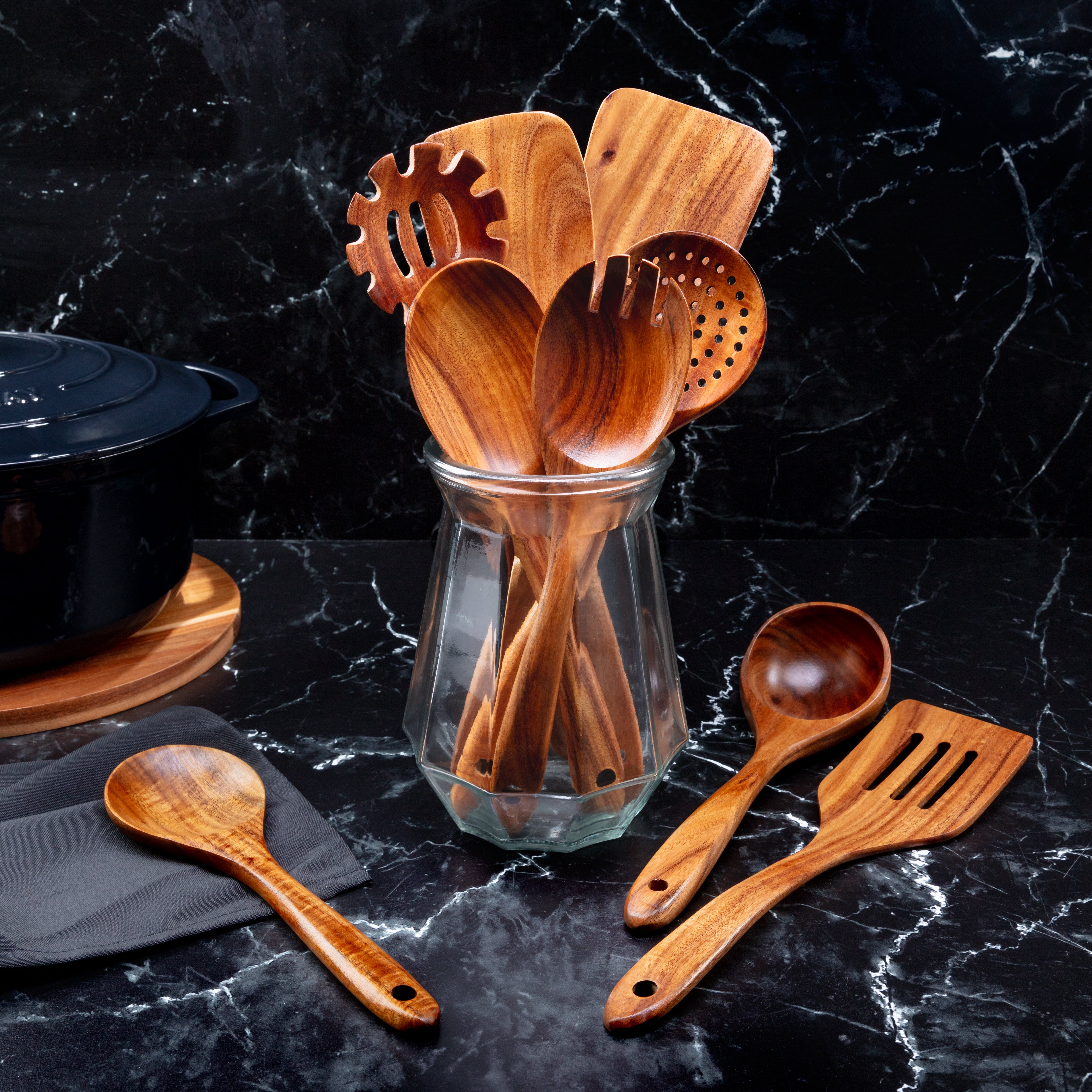 teak wood utensil set on a kitchen counter