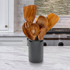 teak wood utensil set on a kitchen counter