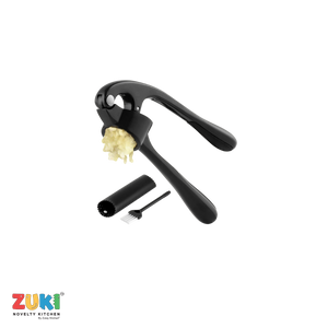 Black garlic press with minced garlic, cleaning brush, and peeler on a white background, featuring the ZUKI brand.