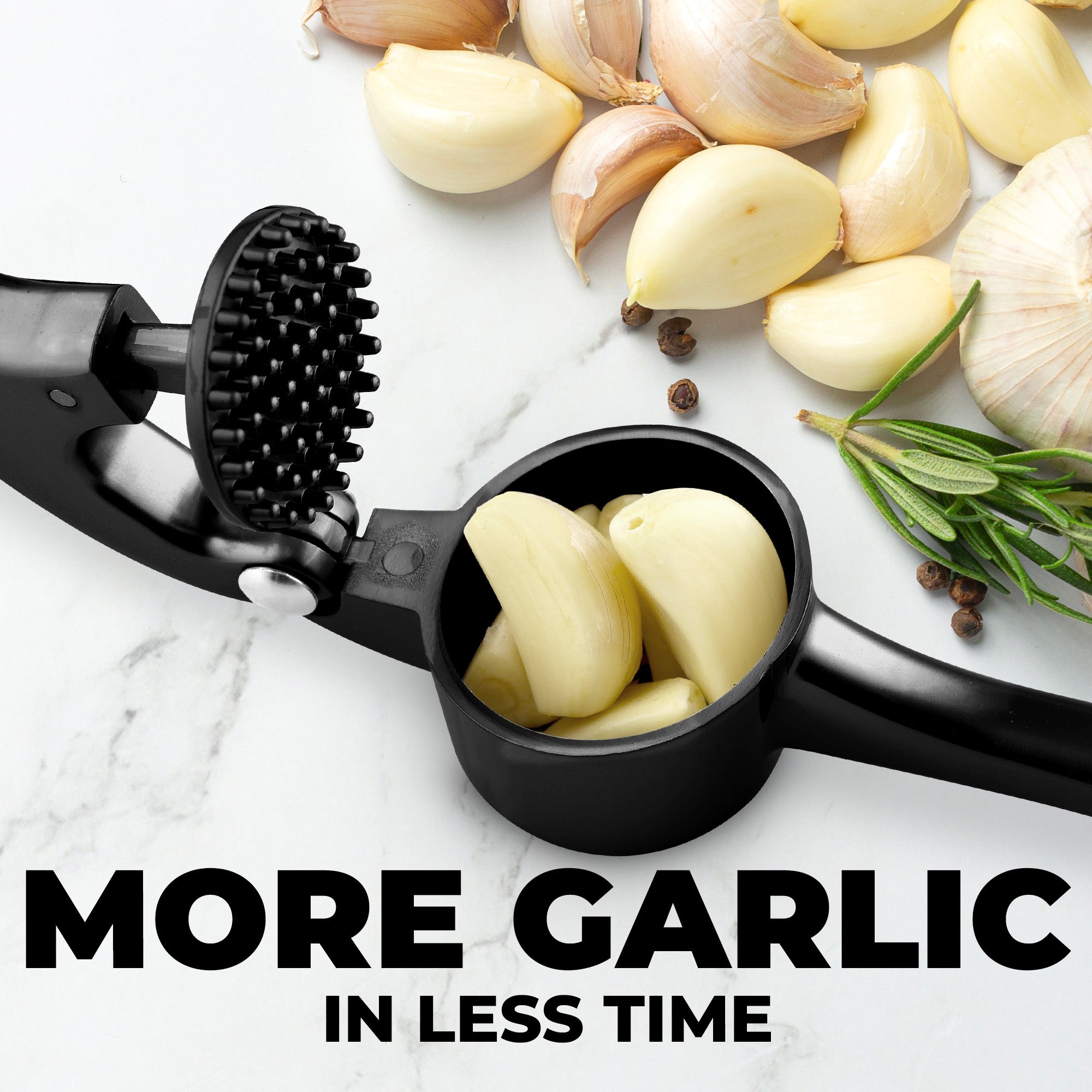 Black garlic peeling tool with peeled garlic cloves on a marble surface.