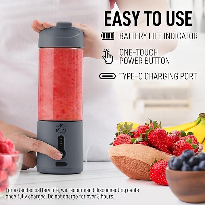Portable blender with features highlighted, surrounded by fruits on a table.
