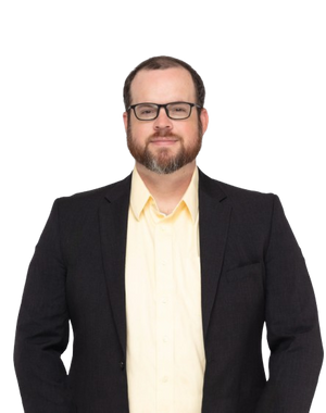 Gavin wearing a black blazer and yellow shirt on a white background