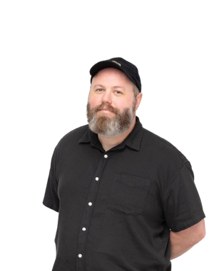 Scott wearing a black cap and black shirt on a white background