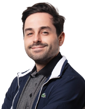 David wearing a navy blue jacket with a brand logo on a white background