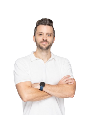 Dylan wearing a white shirt with arms crossed on a white background