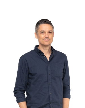 Gabe wearing a navy blue button-up shirt on a white background