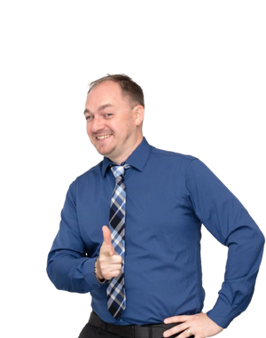 Tom wearing a blue shirt and tie giving a thumbs-up gesture on a white background