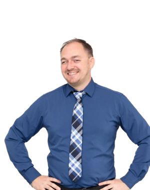 Tom wearing a blue shirt and plaid tie on a white background