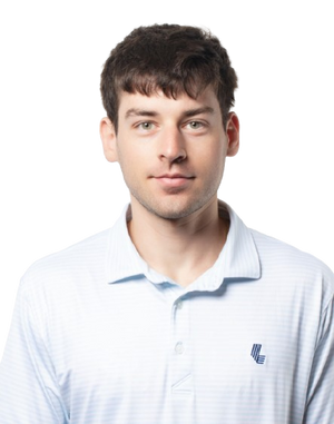 Cobi wearing a light blue polo shirt with a logo on a white background